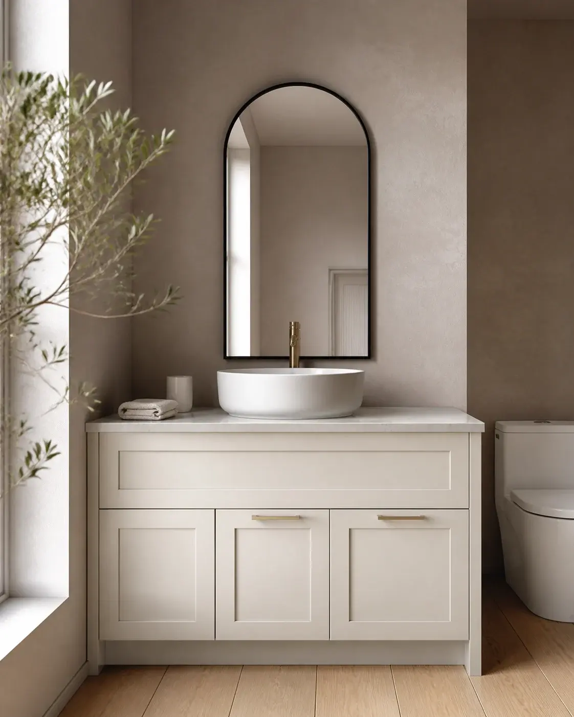 Warm white shaker bathroom vanity with black arched mirror